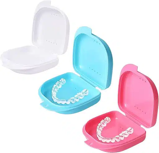 Clear retainers stored in ventilated retainer cases to prevent odor and bacteria buildup